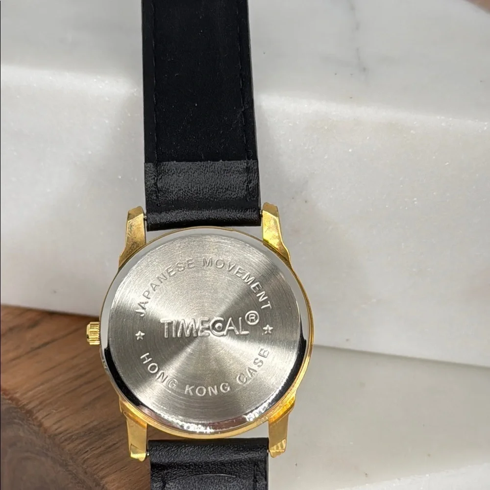Vintage Affirmed Black and Gold Watch with Horse Design lot W2